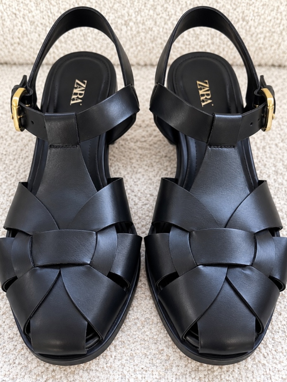 Zara black braided leather sandals with buckle ankle strap.